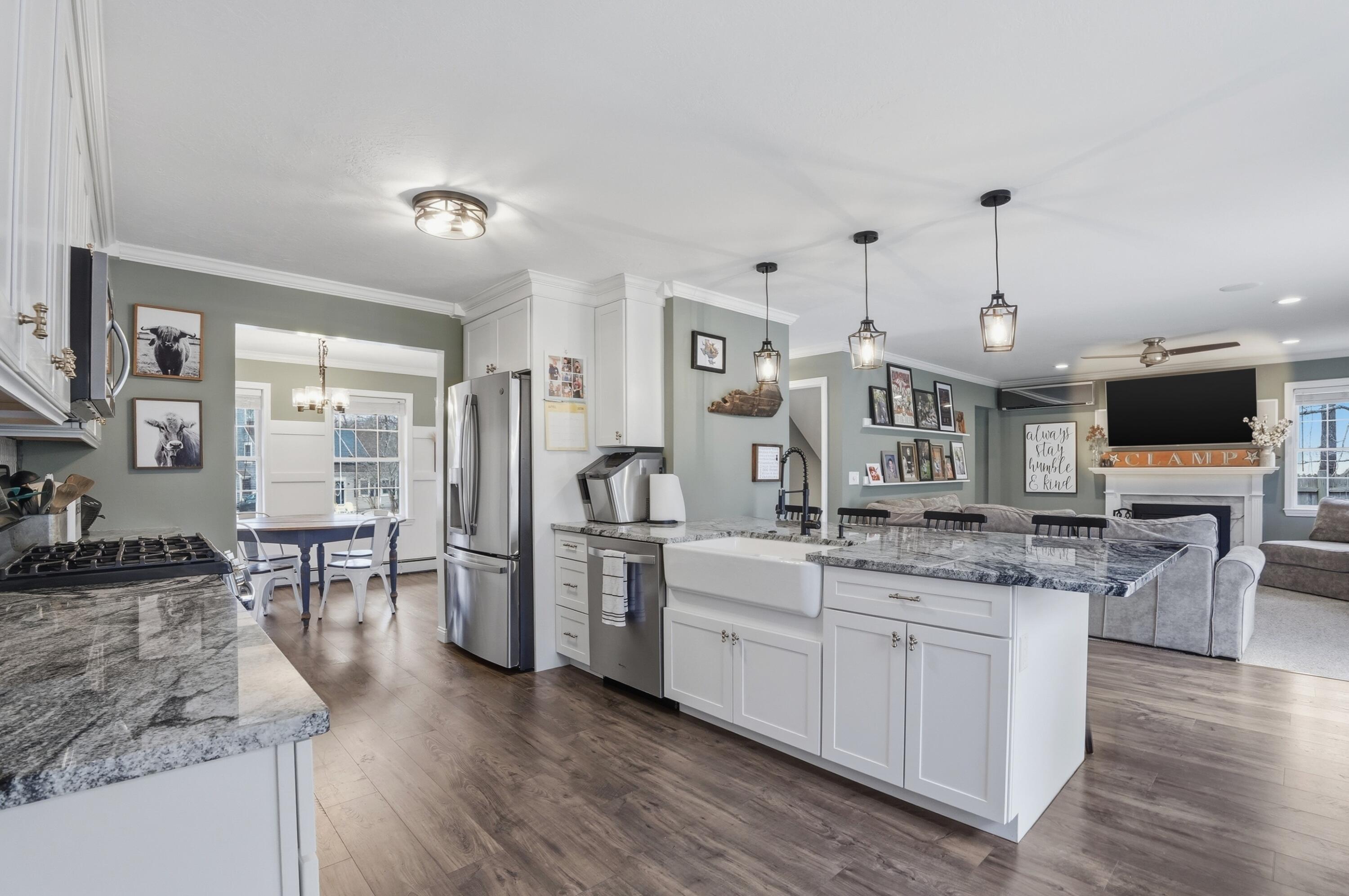 3 Dover Lane Buzzards Bay, MA 02532 - Photo 7 of 51 a open kitchen with stainless steel appliances kitchen island granite countertop a stove and cabinets