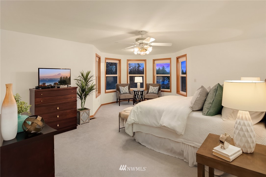 14010 282nd Lane Northeast Duvall, WA 98019 - Photo 15 of 31 a spacious bedroom with a bed and furniture