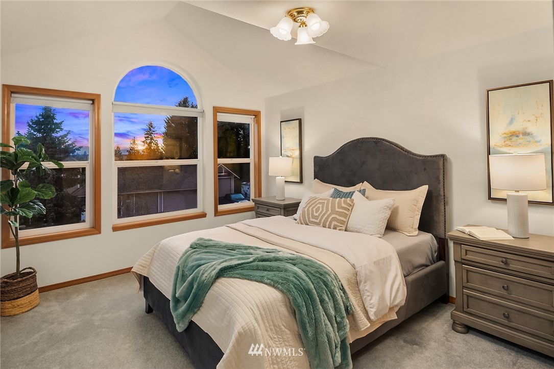 14010 282nd Lane Northeast Duvall, WA 98019 - Photo 20 of 31 a bedroom with a bed and a painting on the wall