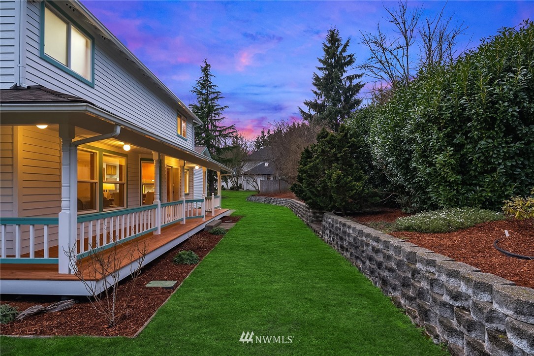 14010 282nd Lane Northeast Duvall, WA 98019 - Photo 22 of 31 a view of a house with backyard and porch