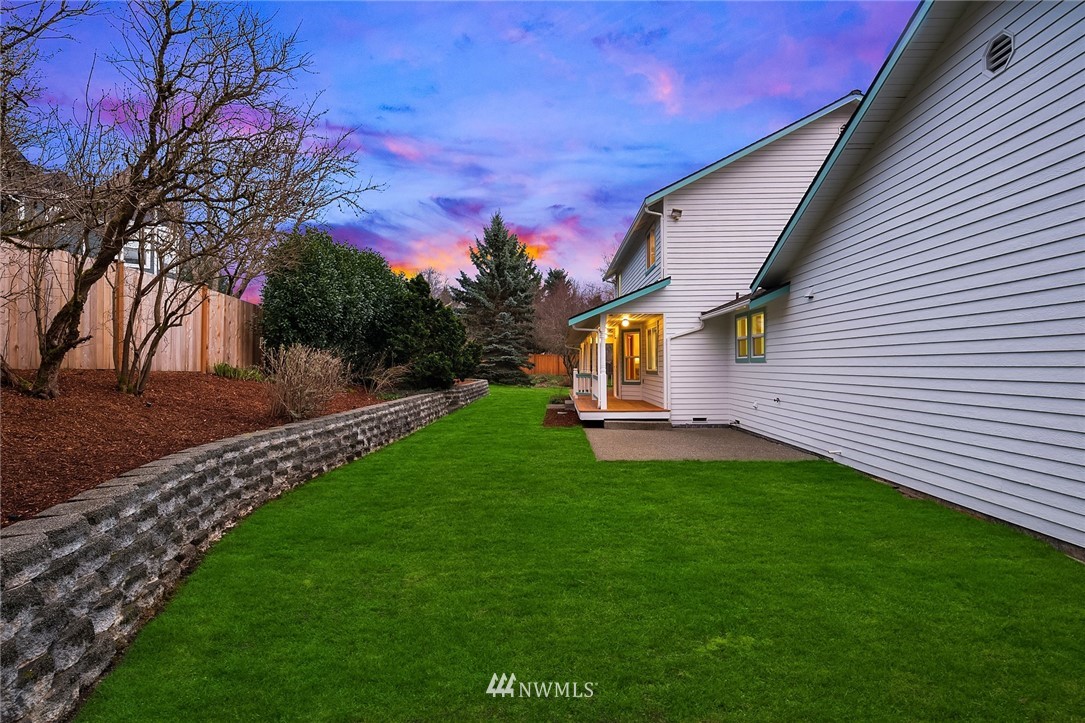 14010 282nd Lane Northeast Duvall, WA 98019 - Photo 23 of 31 a front view of a house with a garden