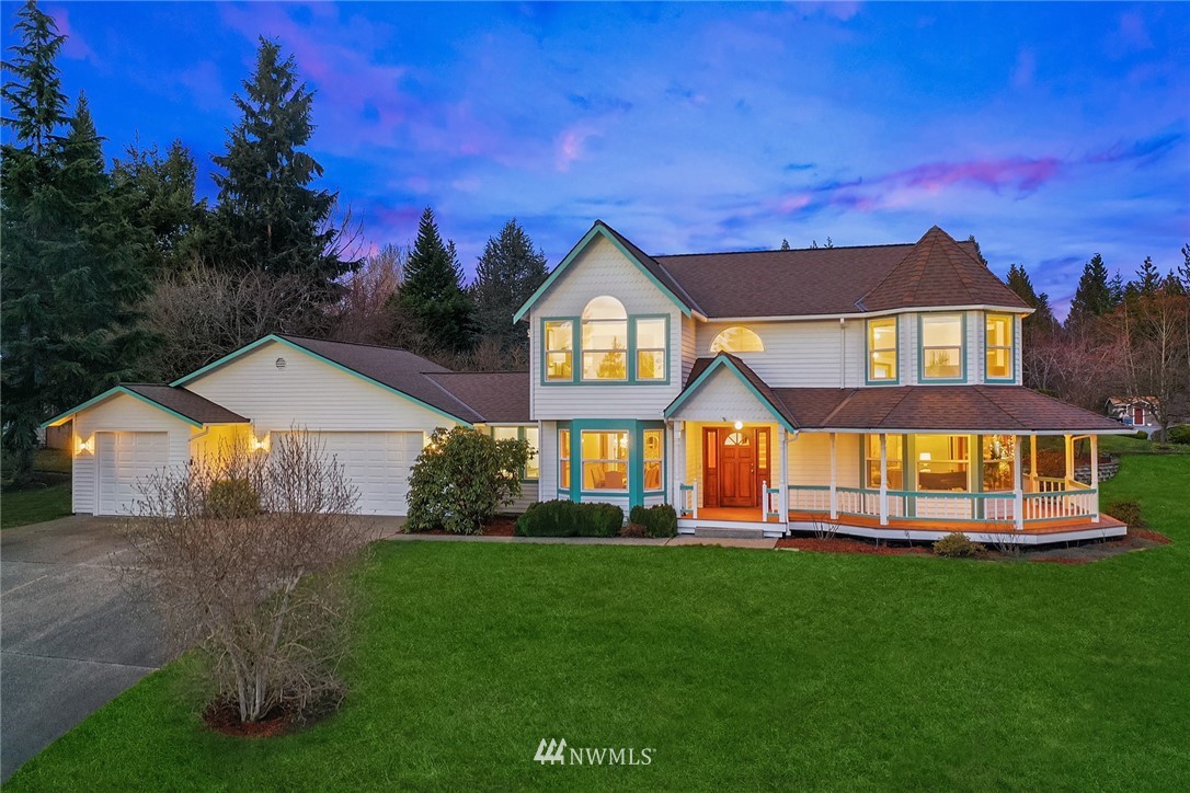 14010 282nd Lane Northeast Duvall, WA 98019 - Photo 25 of 31 a front view of a house with a yard