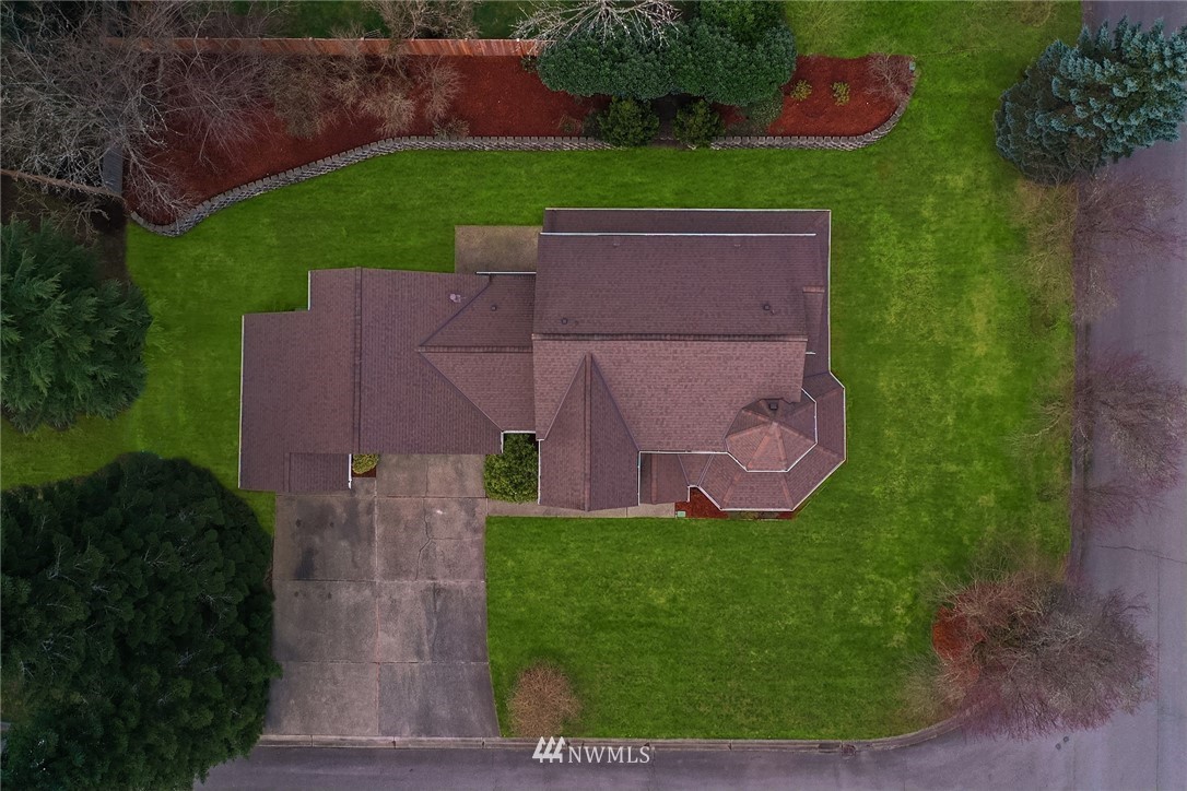 14010 282nd Lane Northeast Duvall, WA 98019 - Photo 26 of 31 an aerial view of a house with a garden and trees