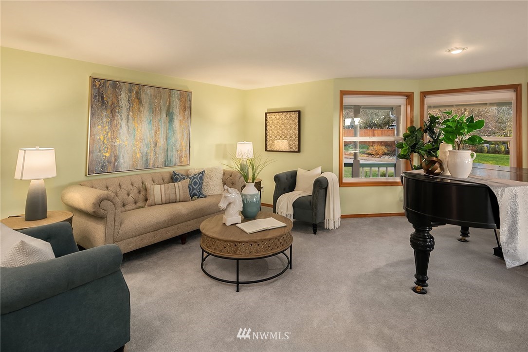 14010 282nd Lane Northeast Duvall, WA 98019 - Photo 3 of 31 a living room with furniture and a potted plant