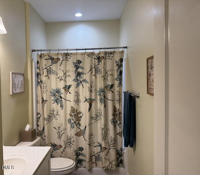 574 East Ridge Avenue Liberty, NC 27298 - Photo 15 of 28 a bathroom with a shower curtain and a toilet