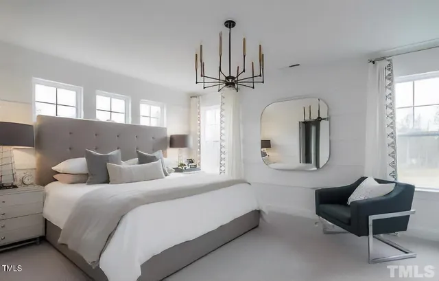 a large kitchen with a table and chairs