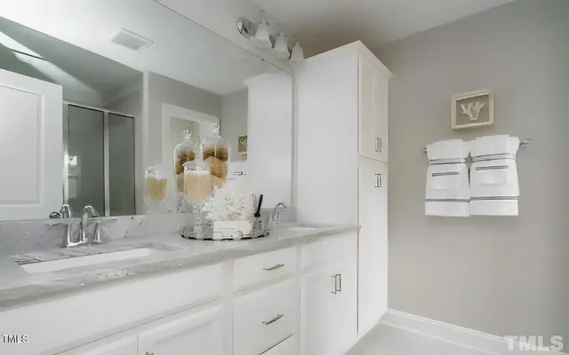 a large kitchen with lots of counter space dining table and chairs