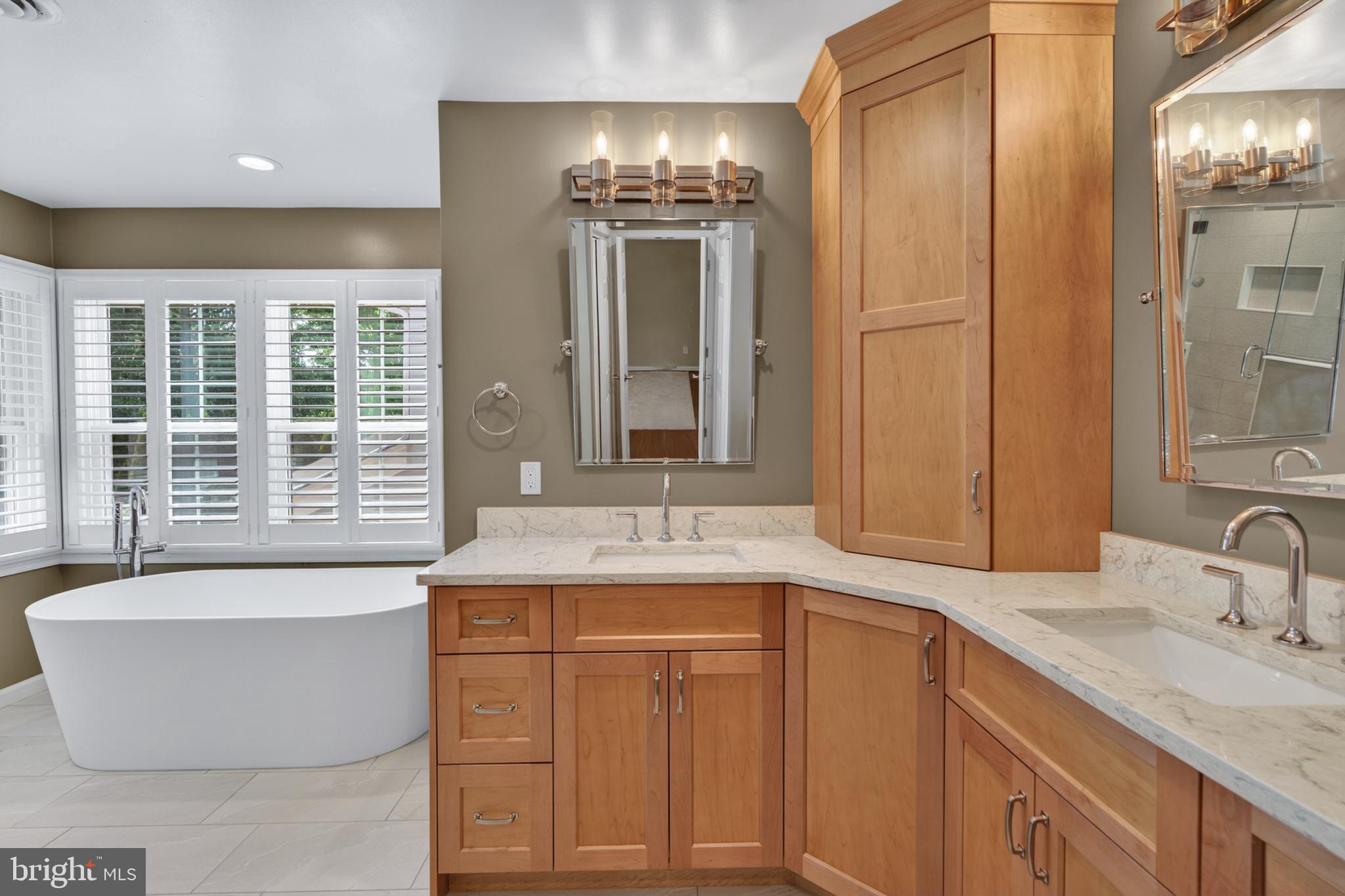 6 Nearfield Road Lutherville-Timonium, MD 21093 - Photo 41 of 71 a bathroom with a granite countertop sink and a large mirror