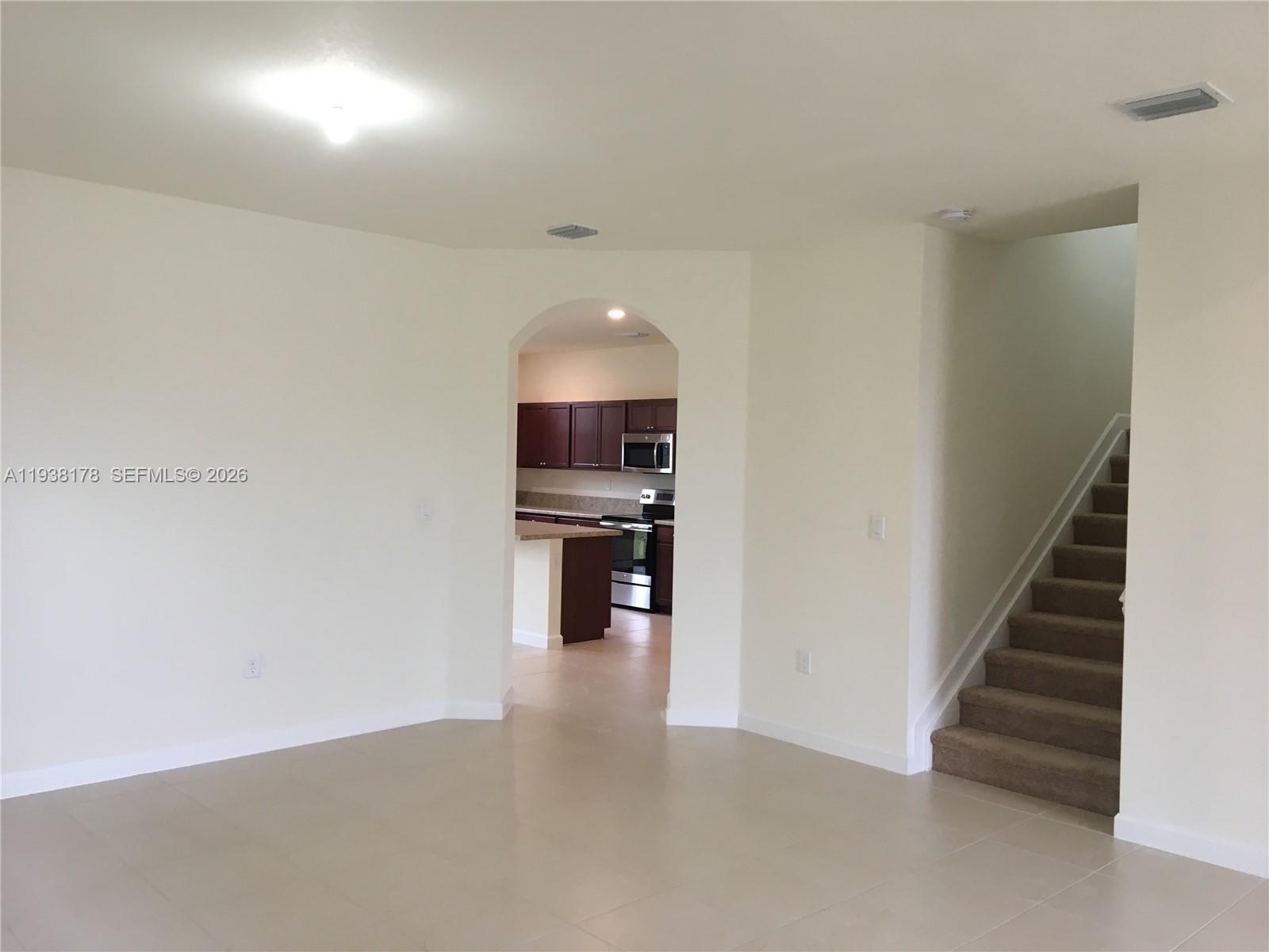 191 Southeast 35 Avenue Homestead, FL 33033 - Photo 8 of 22 a view of empty room with wooden floor