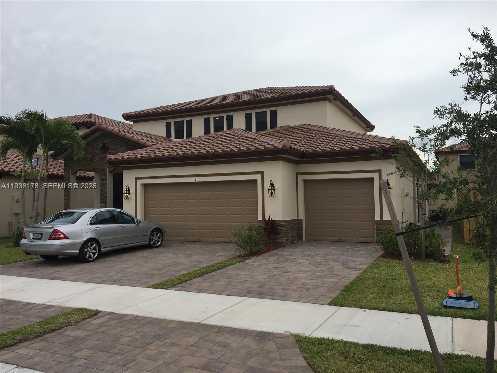 191 Southeast 35 Avenue Homestead, FL 33033 - Photo 10 of 22 a view of a car parked in front of a house