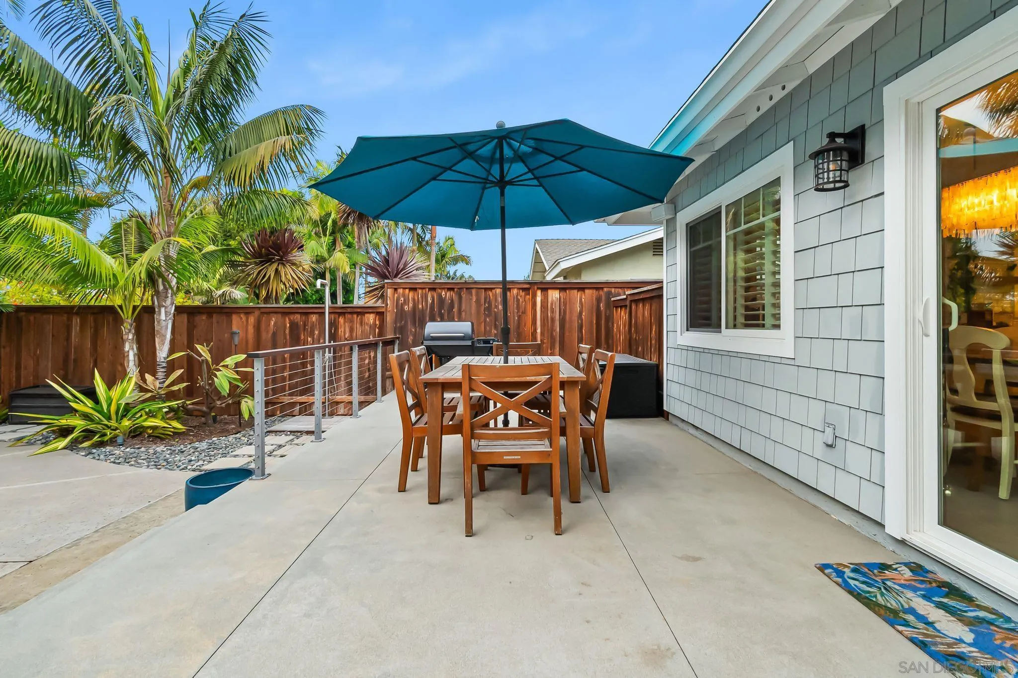 13814 Recuerdo Drive Del Mar, CA 92014 - Photo 22 of 31 a patio with a patio table and chairs