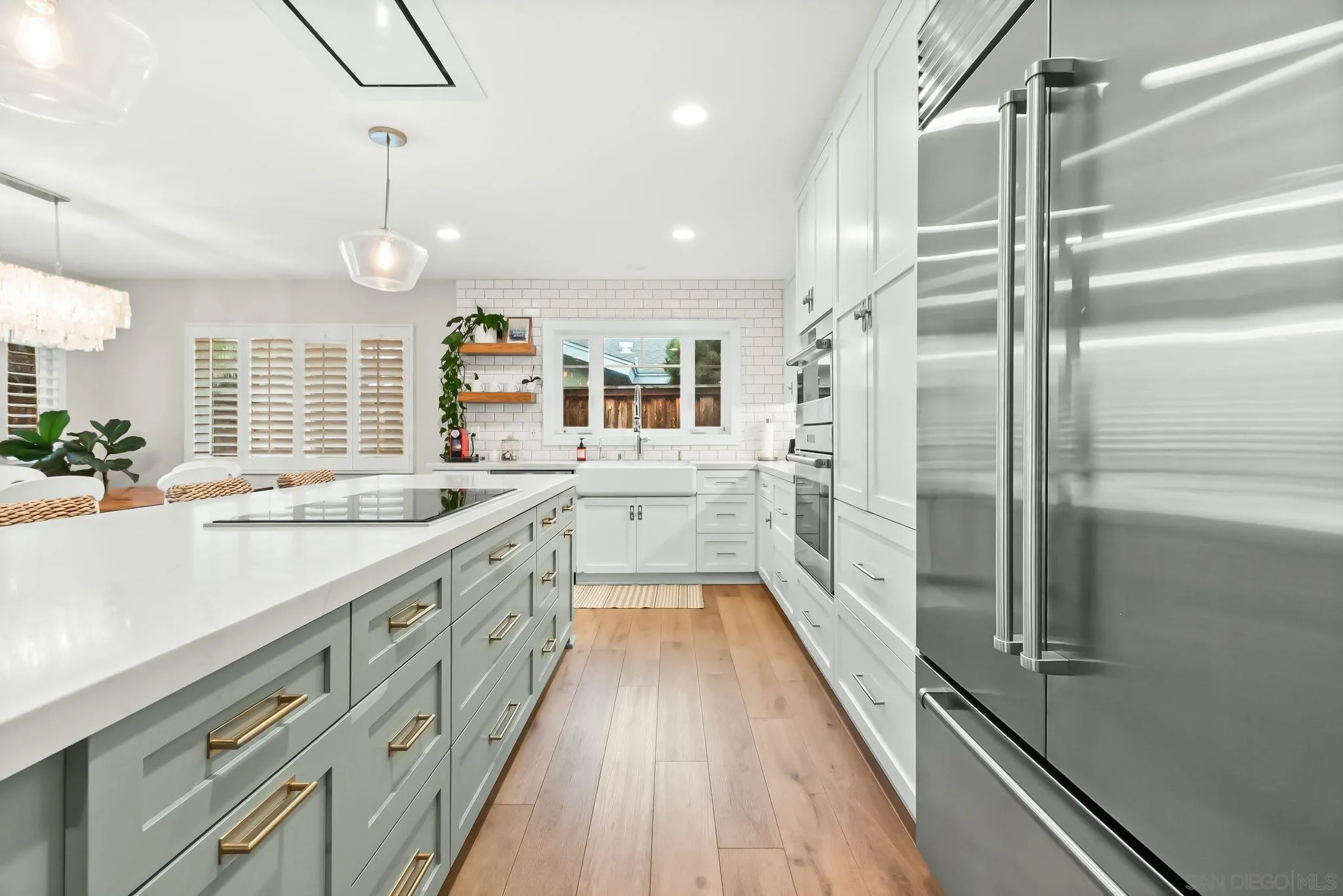 13814 Recuerdo Drive Del Mar, CA 92014 - Photo 8 of 31 a large kitchen with a large window and stainless steel appliances
