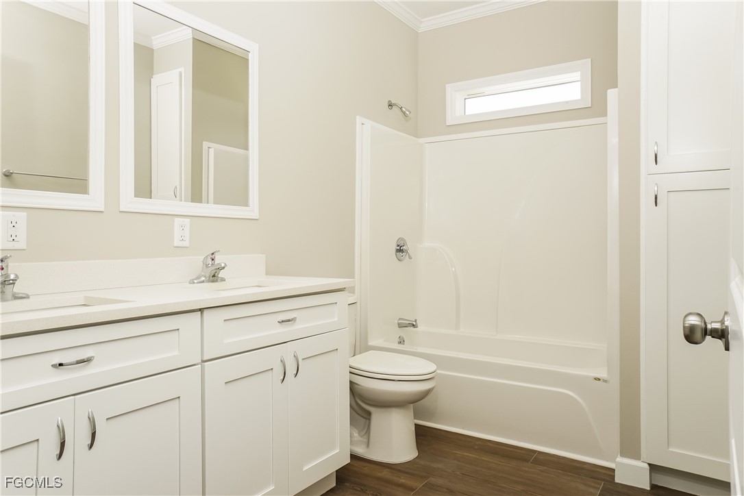 12315 Tangier Street North Port, FL 34287 - Photo 14 of 16 a bathroom with a sink a toilet and shower