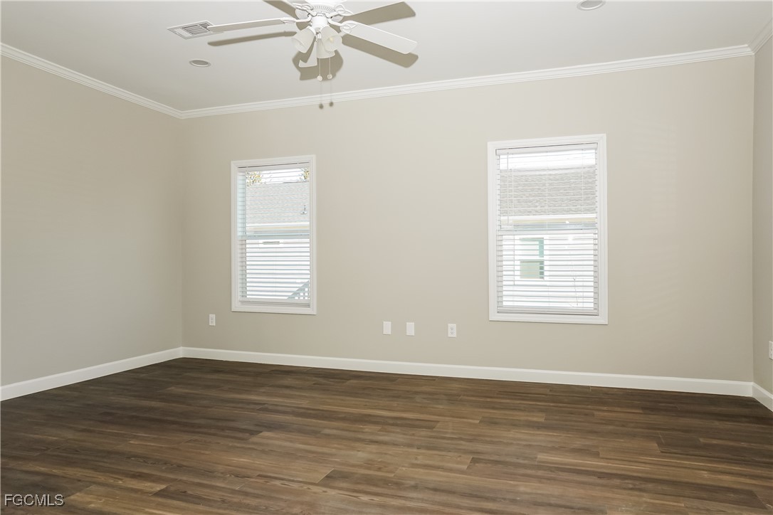 12315 Tangier Street North Port, FL 34287 - Photo 2 of 16 a view of an empty room with wooden floor and a window