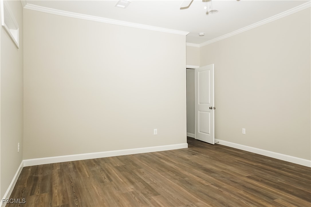 12315 Tangier Street North Port, FL 34287 - Photo 8 of 16 an empty room with wooden floor