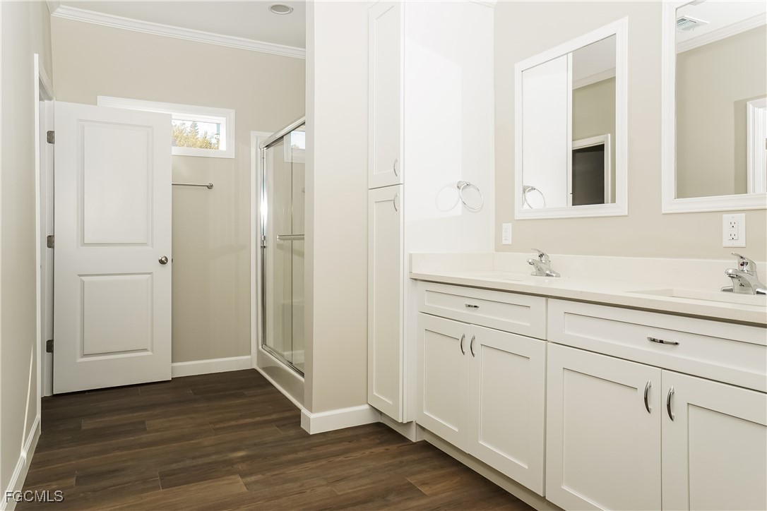 12315 Tangier Street North Port, FL 34287 - Photo 9 of 16 a bathroom with a sink and a mirror