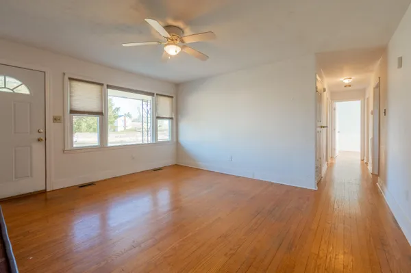 a room with a bed and a window