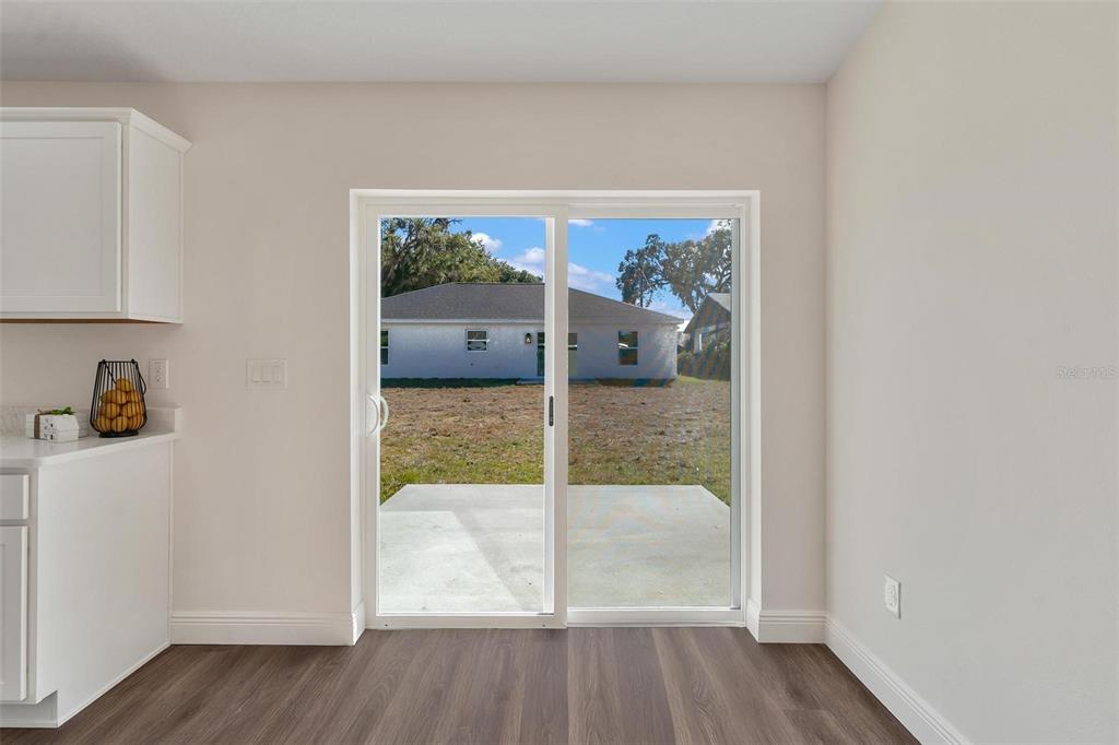 2011 Edgewood Avenue Leesburg, FL 34748 - Photo 12 of 44 a view of a hallway with a glass door