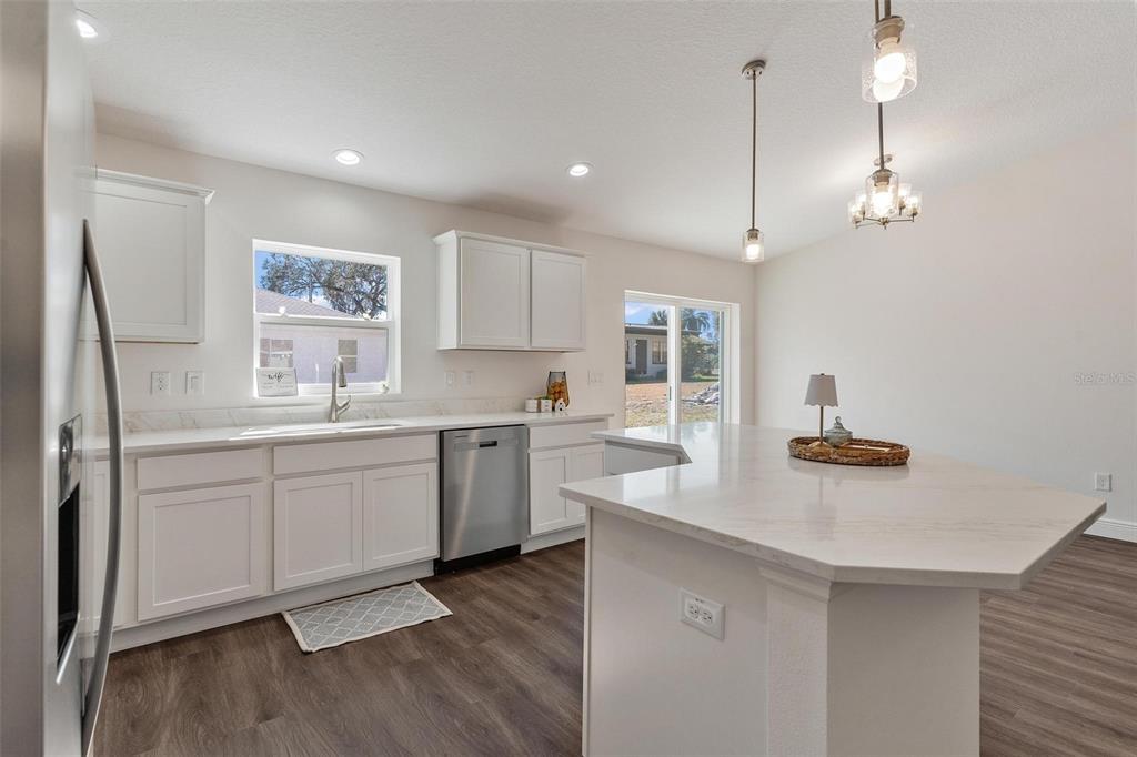 2011 Edgewood Avenue Leesburg, FL 34748 - Photo 16 of 44 a kitchen with white cabinets and sink