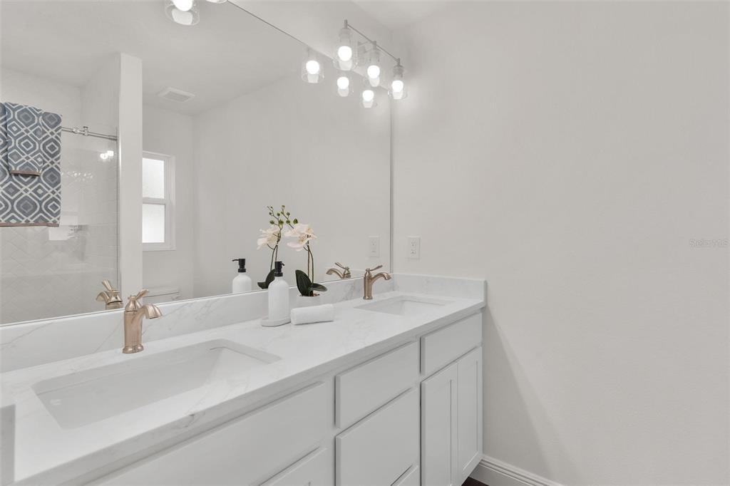 2011 Edgewood Avenue Leesburg, FL 34748 - Photo 22 of 44 a bathroom with a sink and a mirror