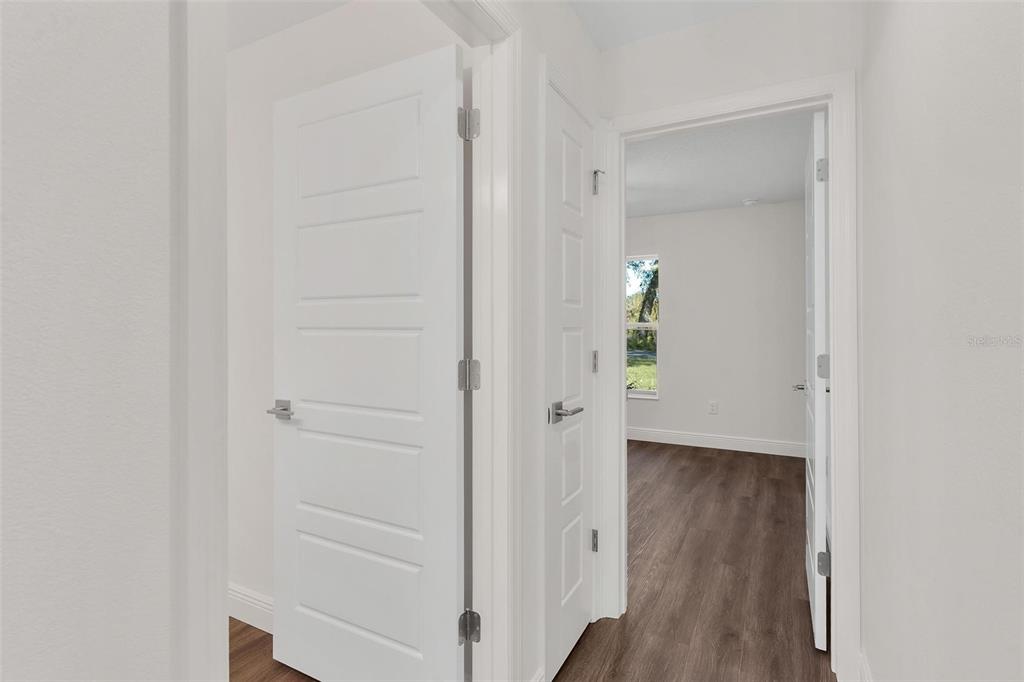 2011 Edgewood Avenue Leesburg, FL 34748 - Photo 26 of 44 a view of a hallway with wooden floor