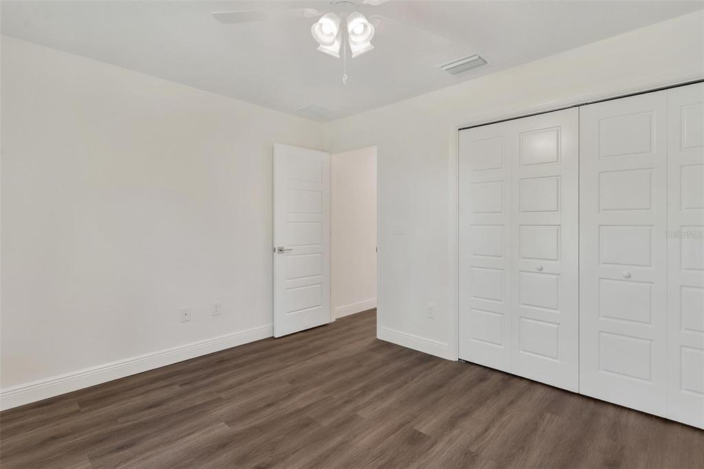 2011 Edgewood Avenue Leesburg, FL 34748 - Photo 28 of 44 a view of an empty room with wooden floor and a window