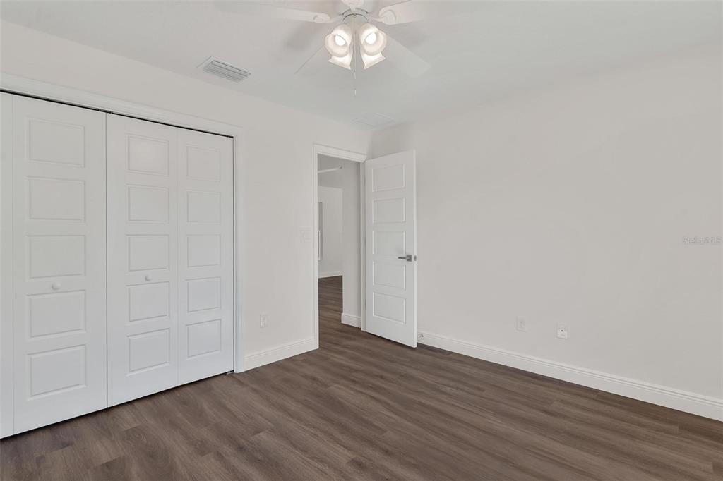 2011 Edgewood Avenue Leesburg, FL 34748 - Photo 31 of 44 a view of an empty room with wooden floor