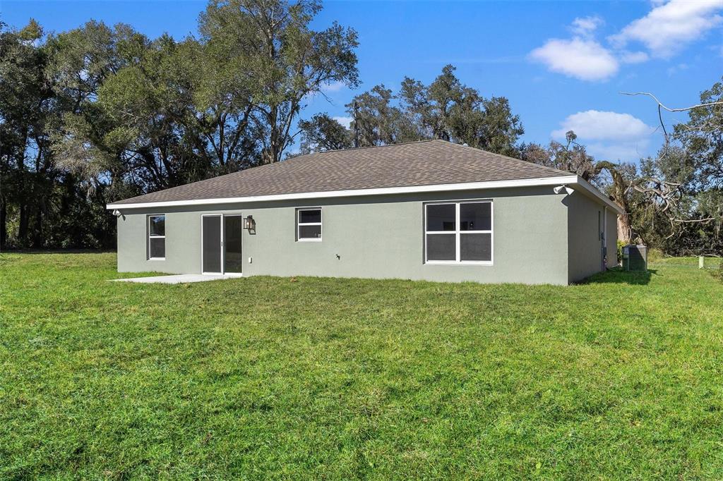 2011 Edgewood Avenue Leesburg, FL 34748 - Photo 36 of 44 a view of a backyard with plants and a garden