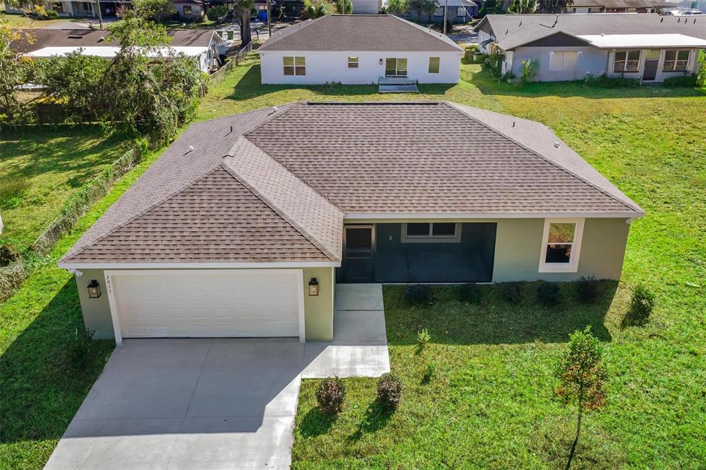 2011 Edgewood Avenue Leesburg, FL 34748 - Photo 37 of 44 a aerial view of a house with a yard
