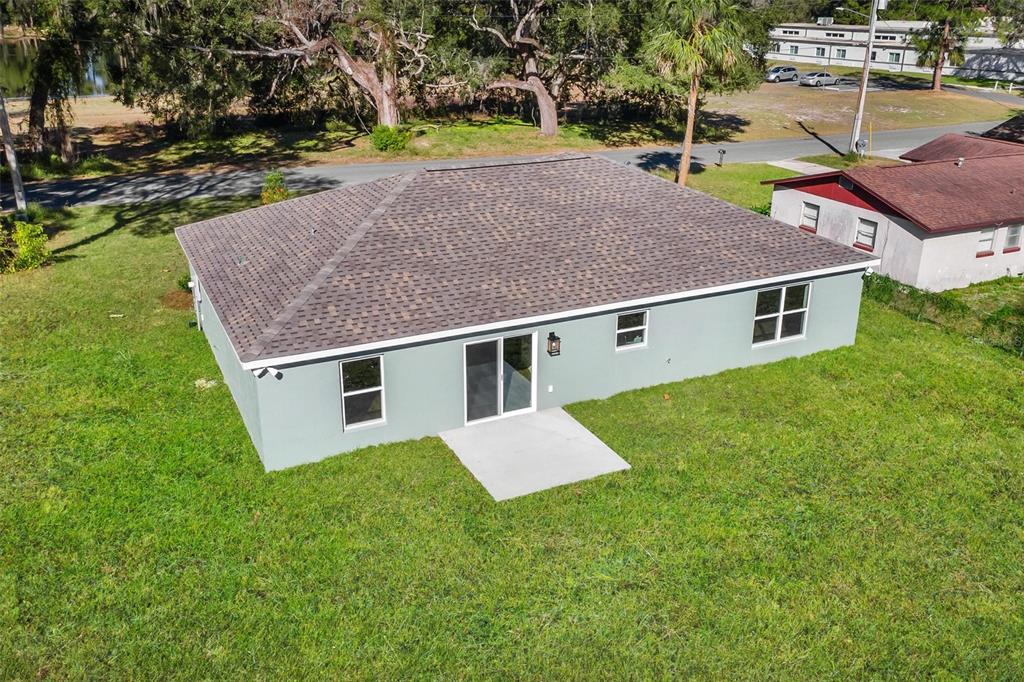 2011 Edgewood Avenue Leesburg, FL 34748 - Photo 42 of 44 a aerial view of a house with a yard and sitting area