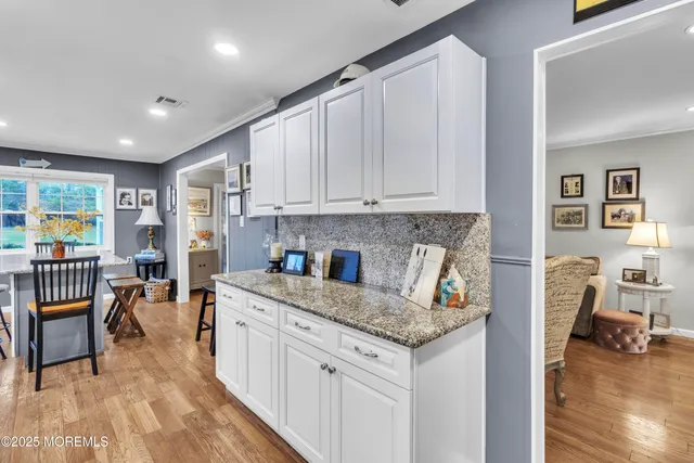 a view of living room with granite countertop furniture and fireplace