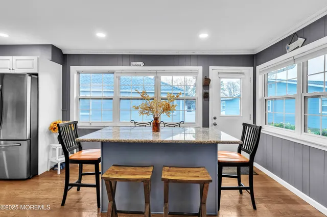 a view of a dining room with furniture and window