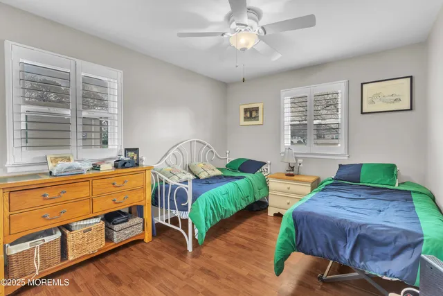 a bedroom with bed and window