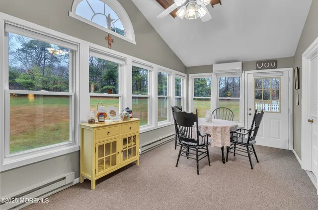 a view of a dining room with furniture window and outside view