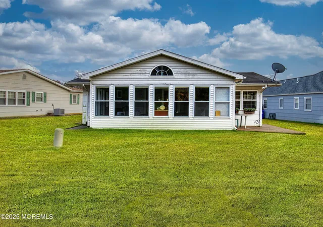 a view of a house with a garden and yard