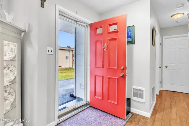 a view of front door with a hallway
