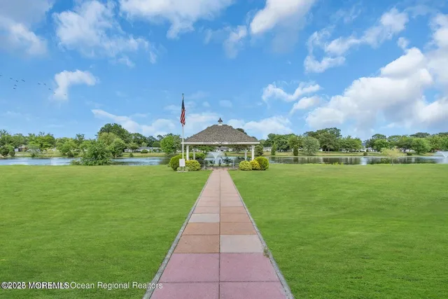 a view of lake with a big yard