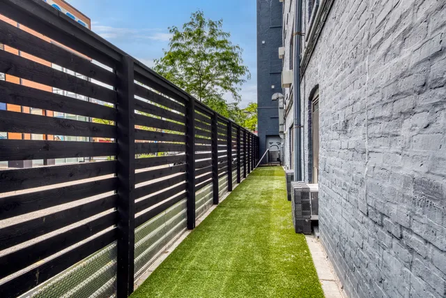 a backyard of a house with lots of green space
