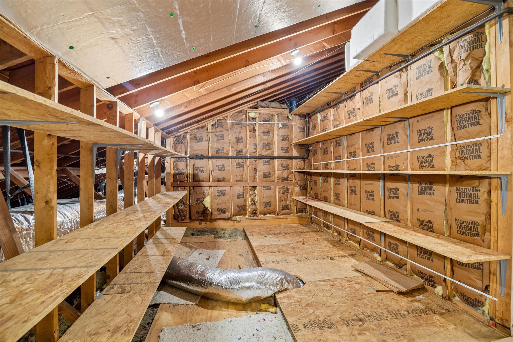 5515 Sylmar Road Houston, TX 77081 - Photo 24 of 28 Situated on the second floor, the attic space doesn't require a ladder to access. Not only does the area have tons of storage, but offers the opportunity to expand the home for more livable space.
