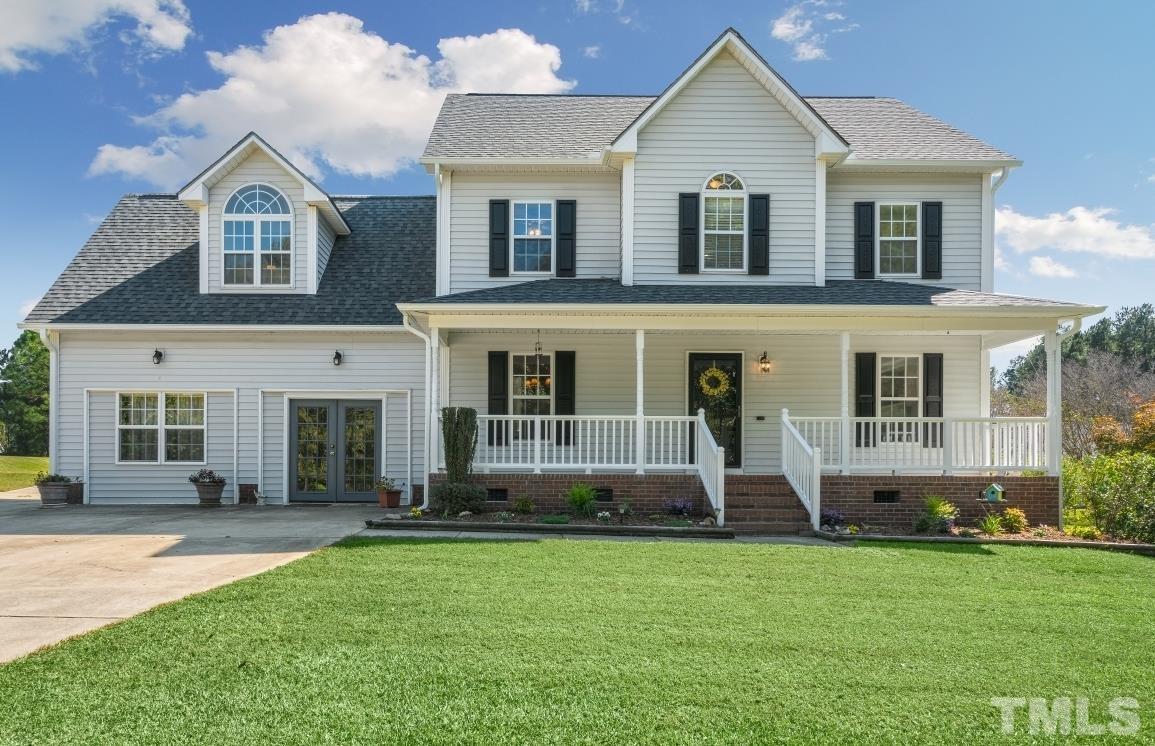 704 Rudy Drive Clayton, NC 27520 - Photo 1 of 30 a front view of a house with a yard
