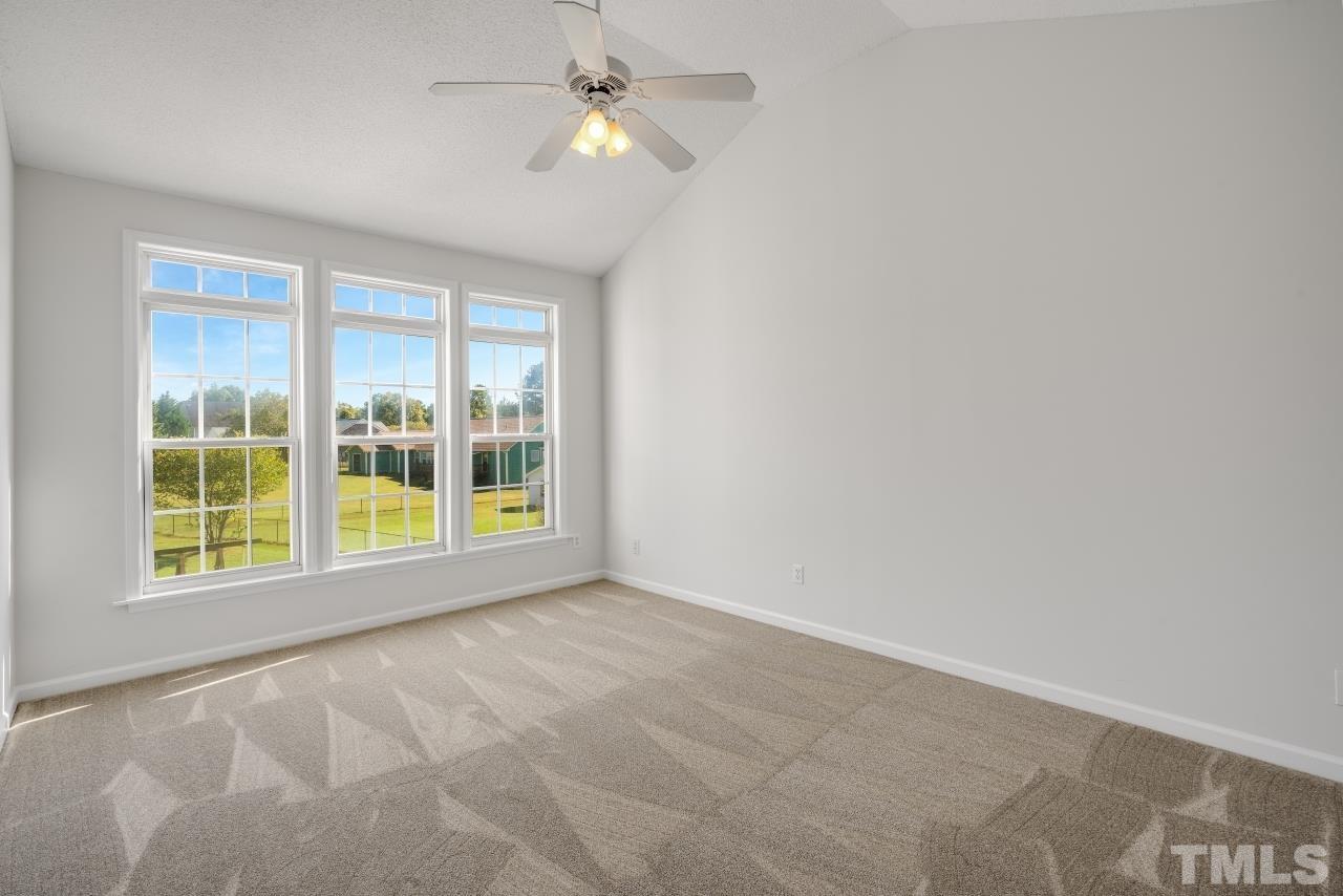 704 Rudy Drive Clayton, NC 27520 - Photo 16 of 30 a view of an empty room with a window