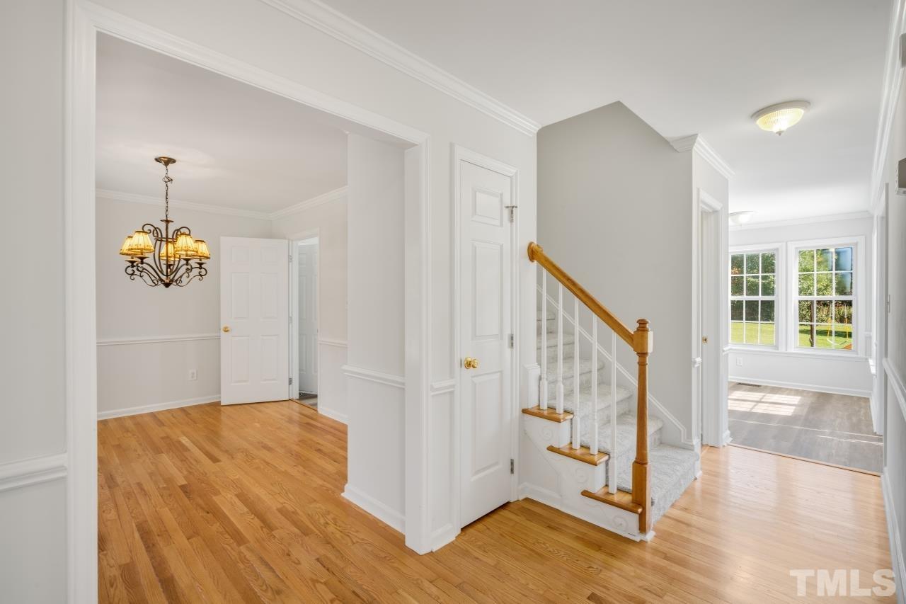 704 Rudy Drive Clayton, NC 27520 - Photo 3 of 30 a view of an entryway with wooden floor
