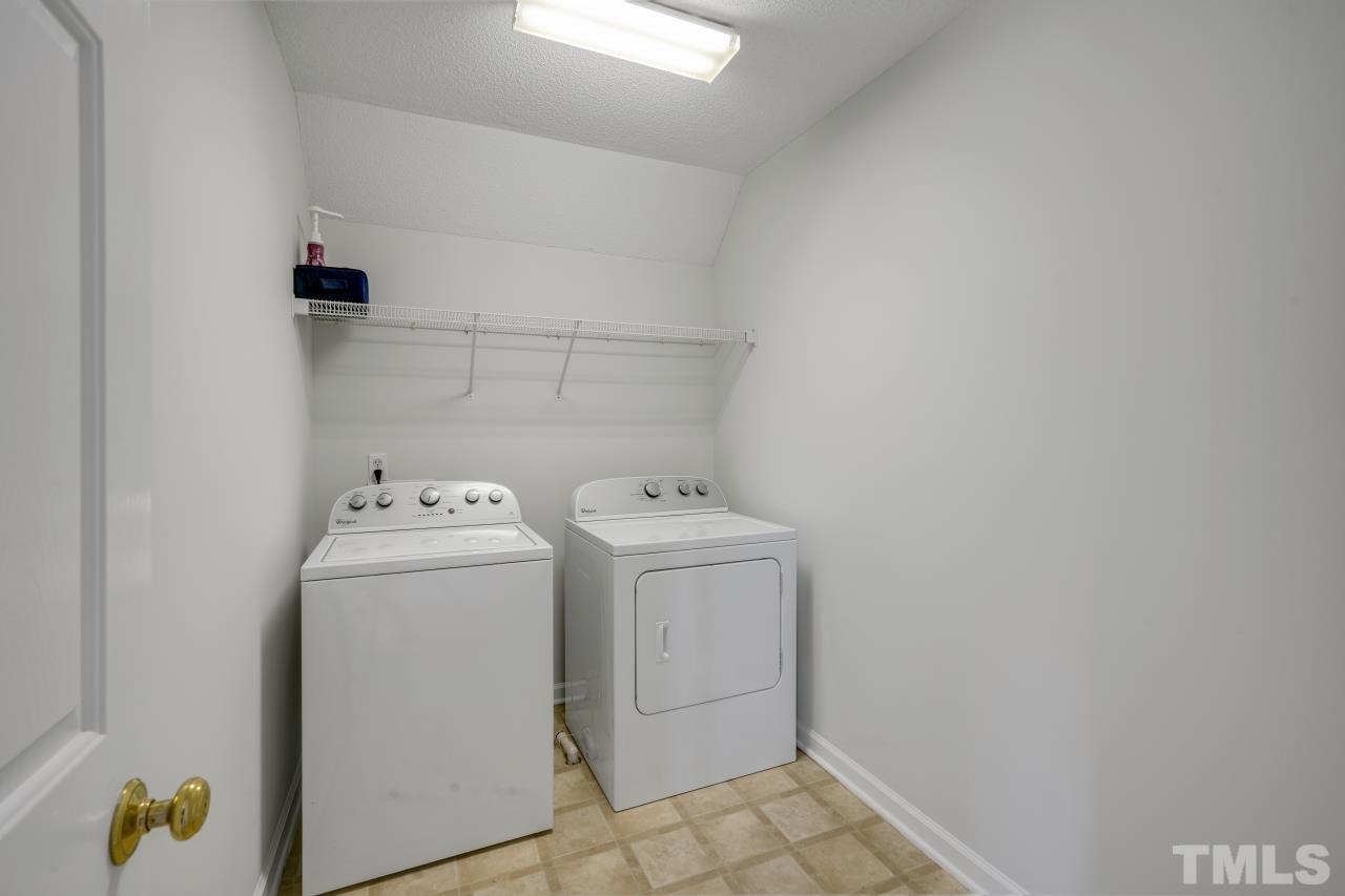 704 Rudy Drive Clayton, NC 27520 - Photo 22 of 30 a utility room with dryer and washer
