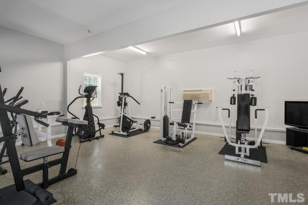 704 Rudy Drive Clayton, NC 27520 - Photo 24 of 30 a view of a room with gym equipment