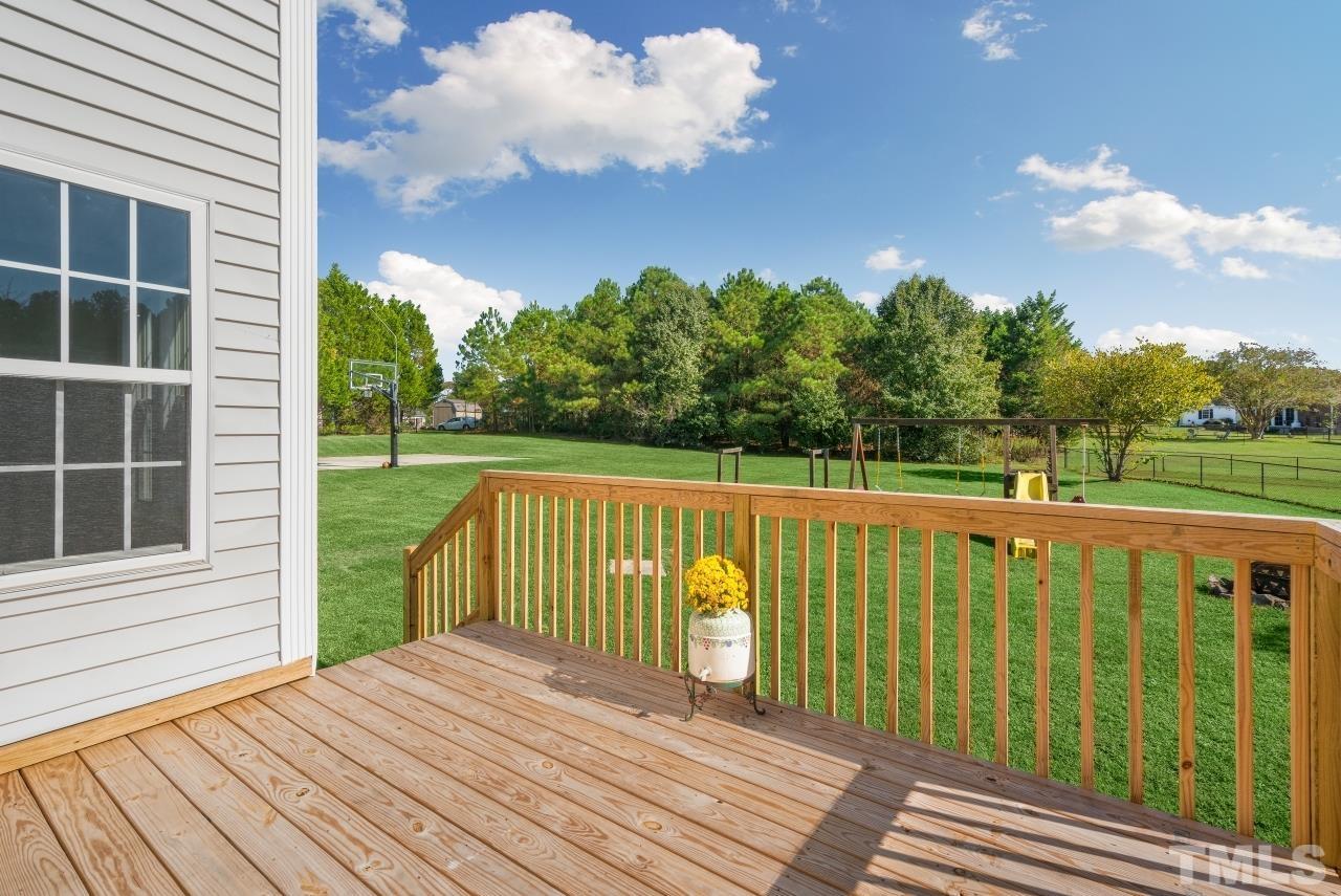 704 Rudy Drive Clayton, NC 27520 - Photo 25 of 30 a view of deck with a backyard