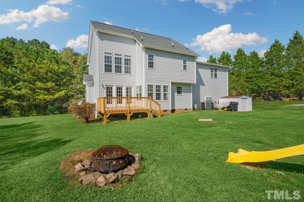 704 Rudy Drive Clayton, NC 27520 - Photo 26 of 30 a front view of a house with a yard table and chairs