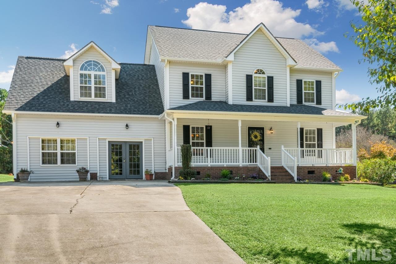 704 Rudy Drive Clayton, NC 27520 - Photo 30 of 30 a front view of a house with a yard and green space