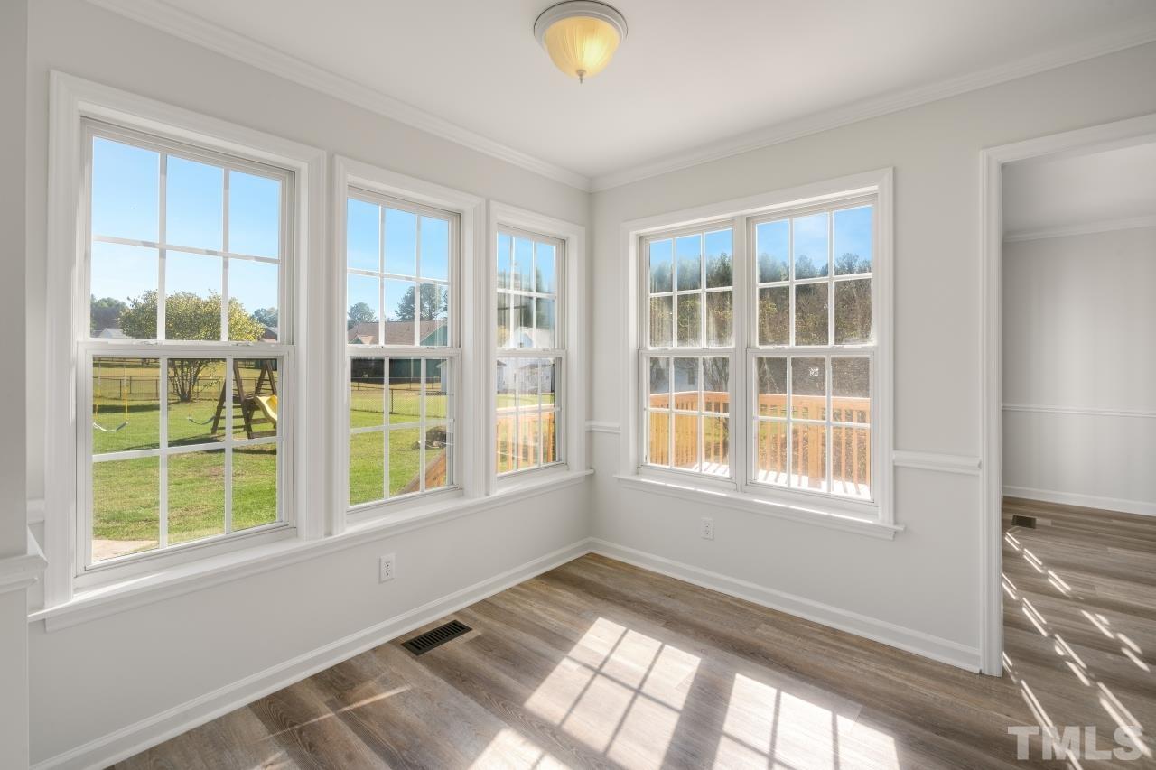 704 Rudy Drive Clayton, NC 27520 - Photo 8 of 30 a view of an empty room with a window