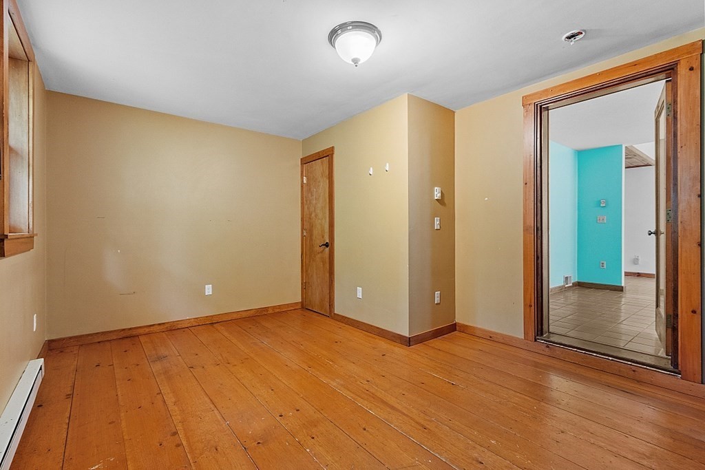 444 Old Dana Road Barre, MA 01005 - Photo 19 of 39 wooden floor in an empty room with a window