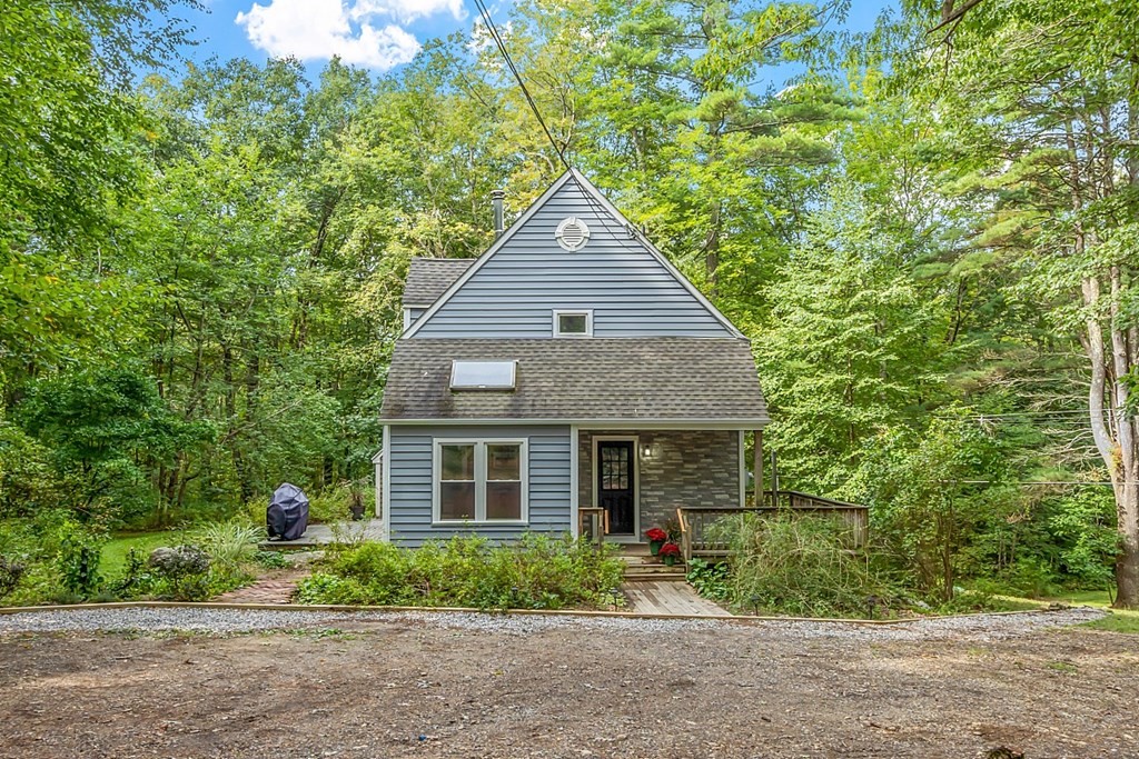444 Old Dana Road Barre, MA 01005 - Photo 2 of 39 a front view of a house with a yard and potted plants